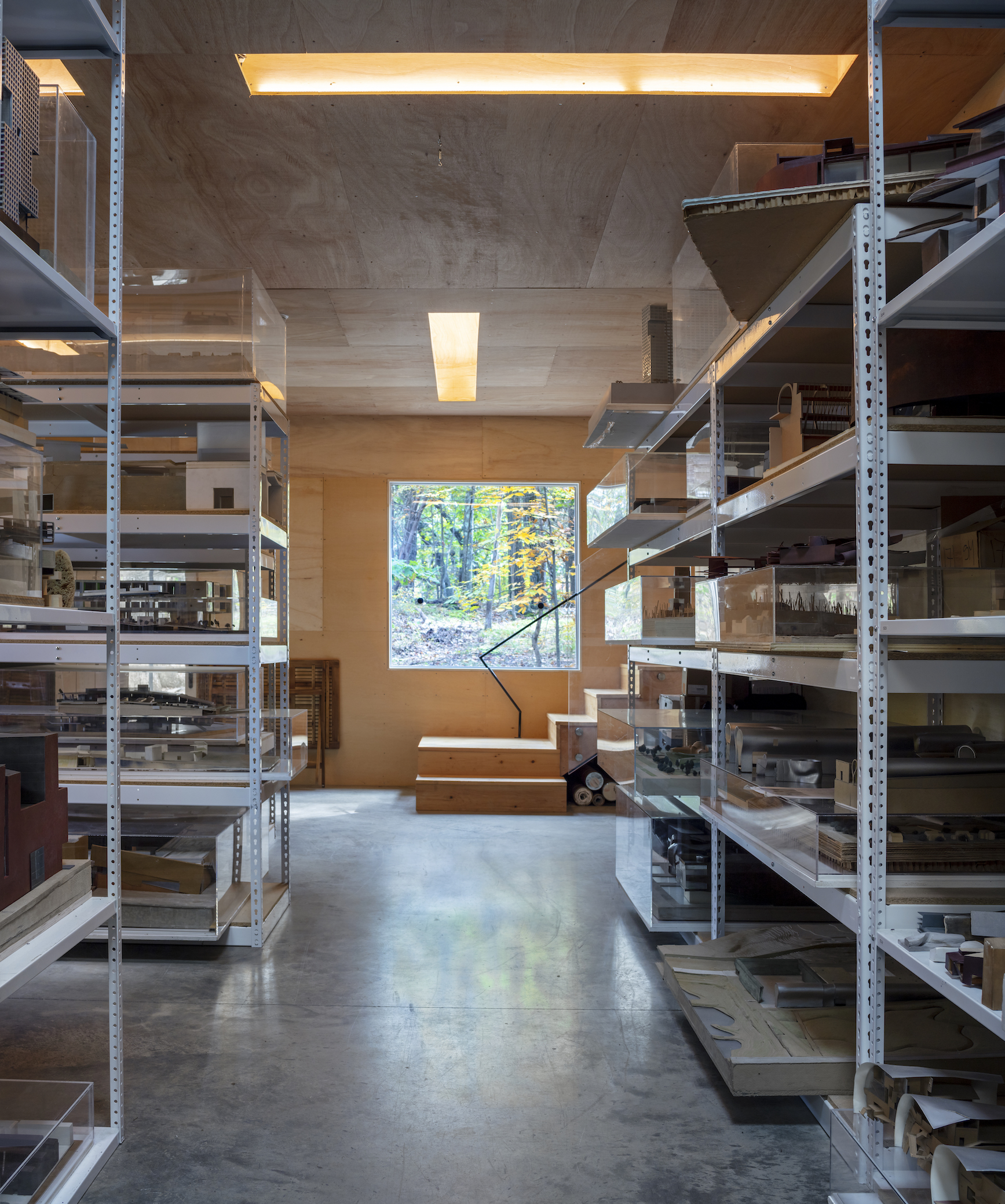 A view into an architecture office archive looking out into a window