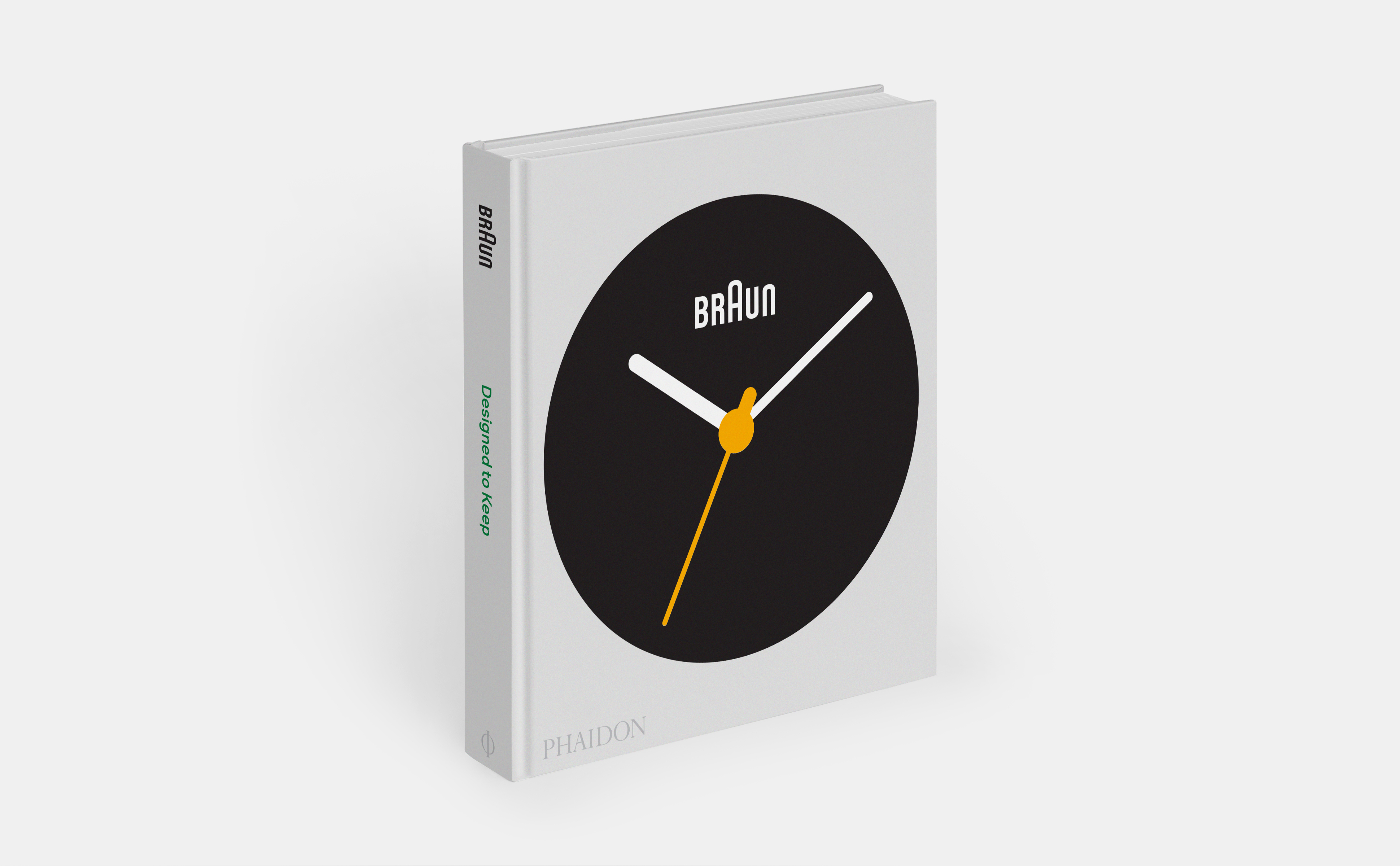 minimalist light gray book with large black, white, and yellow Braun clock on front cover