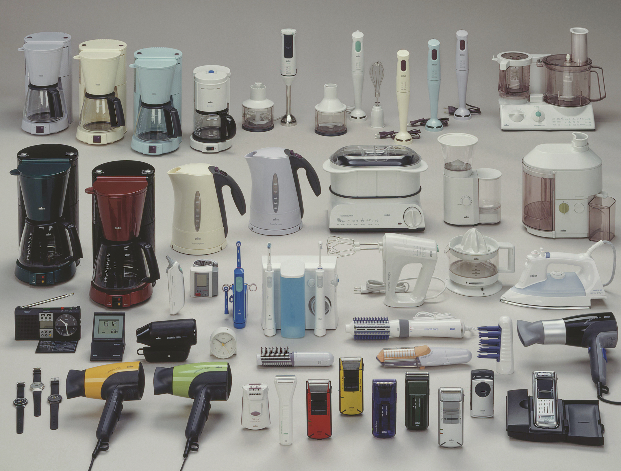 Braun products, from blenders to hair dryers, laid out across a plain light gray background