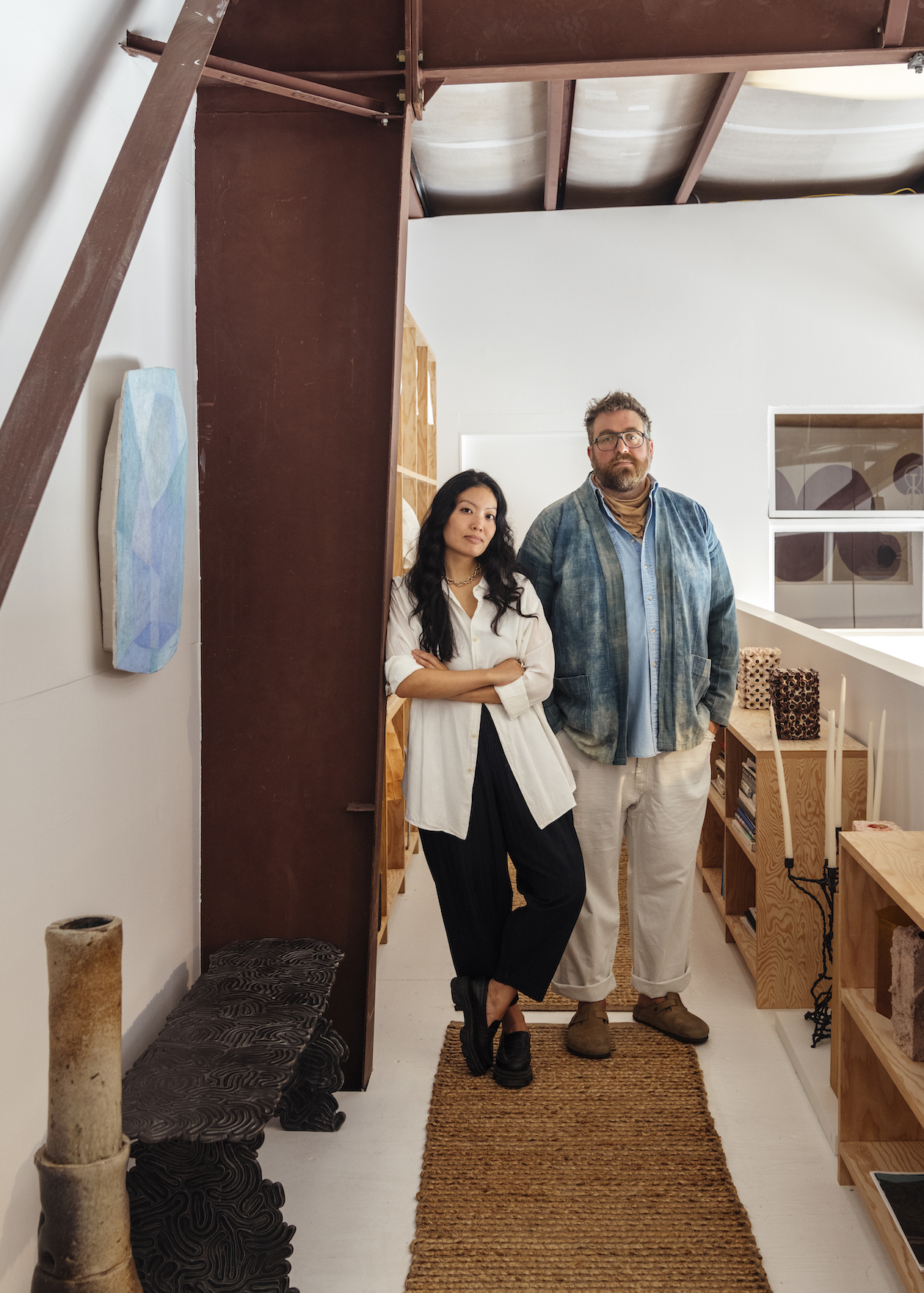 Portrait of Heidi Korsavong and Benjamin Critton surrounded by furniture objects